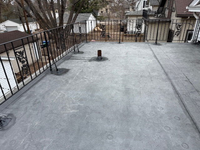 flat roof overhaul on E 25th St in Minneapolis