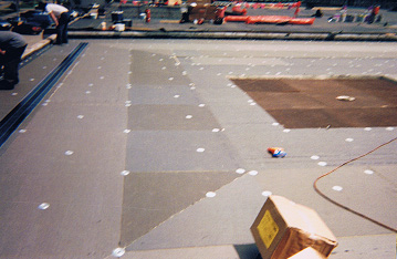 Showing proper taper for drainage purposes on a flat roof membrane